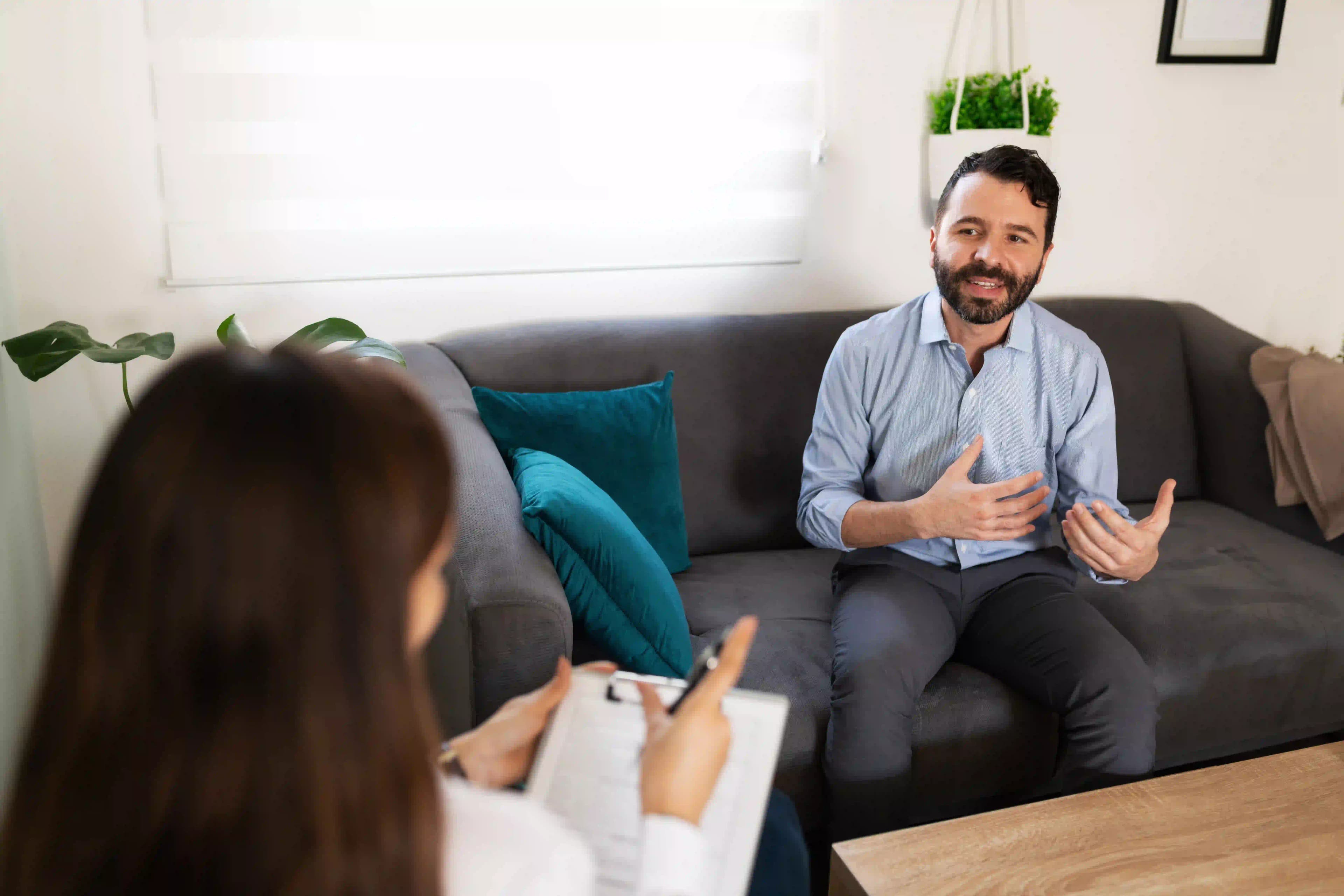 Man talking about his recovery during a counseling session